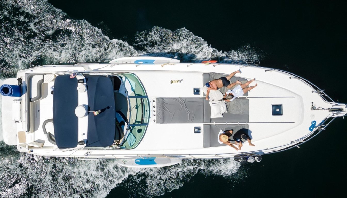 Aerial view of a Sea Ray 50 yacht cruising Banderas Bay with guests on the sundeck during a private yacht charter in Puerto Vallarta